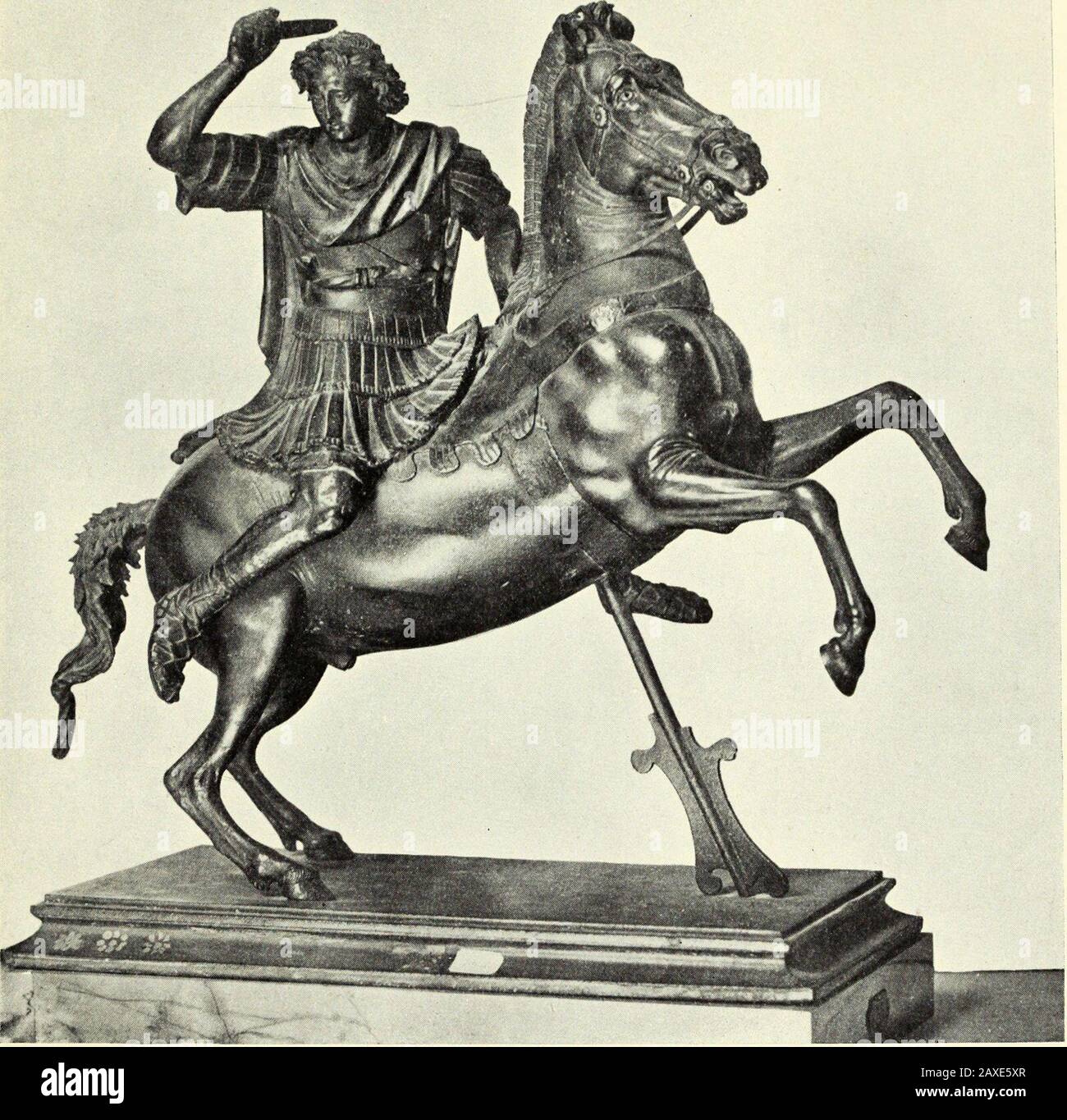 Greek bronzes . Fig. 34.—-Bronze Relief. Greek striking down an Jtnazon. Fourth Century B.C. British Museum. GREEK BRONZES 8S make a commemorative group of Alexander and those who were nearesthim in the fight, in all, twenty-five figures, each a portrait. That. Fig. 35.—-Alexander the Great. Large Bronze Statuette. Naples Museum. group was erected in Macedonia, but subsequently was carried off byMetellus to Rome, and possibly the Naples bronze represents the centralfigure of that composition. VI Gaulish Bronzes Certain ancient writers attribute to the Gauls the invention of enamellingand niell Stock Photo