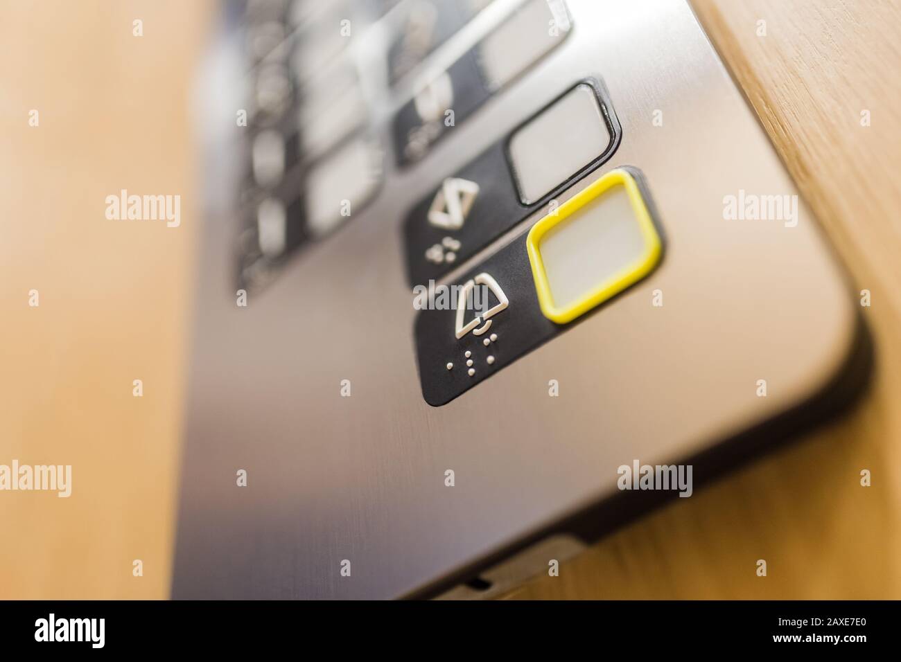 Close up of elevator alarm button on control panel. Emergency concept. Stock Photo