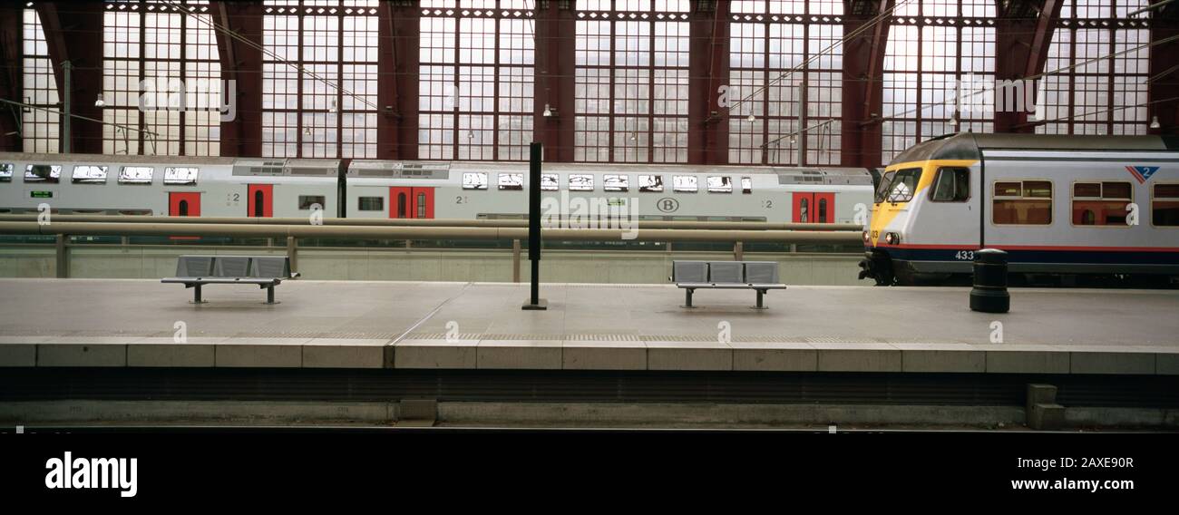 Trains at a railroad station platform, Antwerp, Belgium Stock Photo