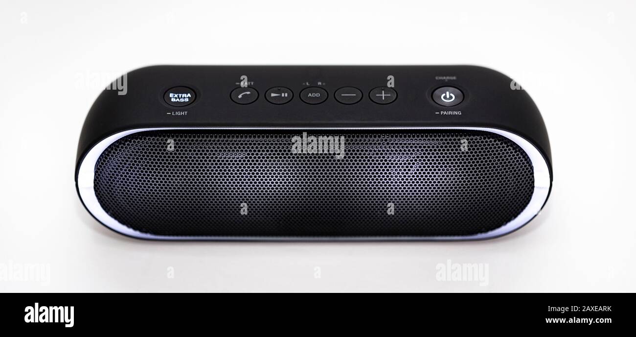 Black Bluetooth speaker with lights on isolated in white background Stock Photo