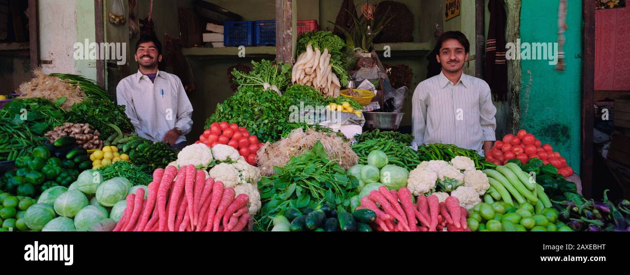 Portrait of two grocers smiling, Nagaur, Rajasthan, India Stock Photo