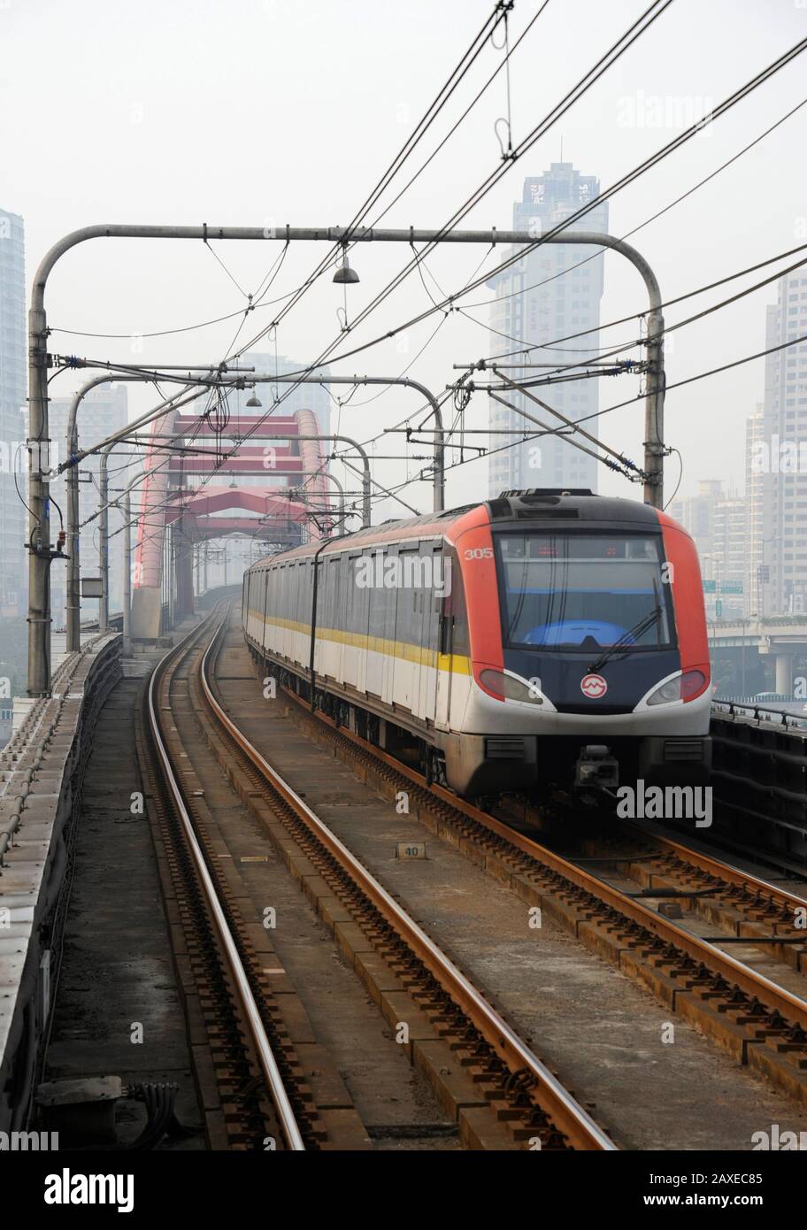 Shanghai metro line 3 train approaches a bridge, Shanghai, China Stock Photo