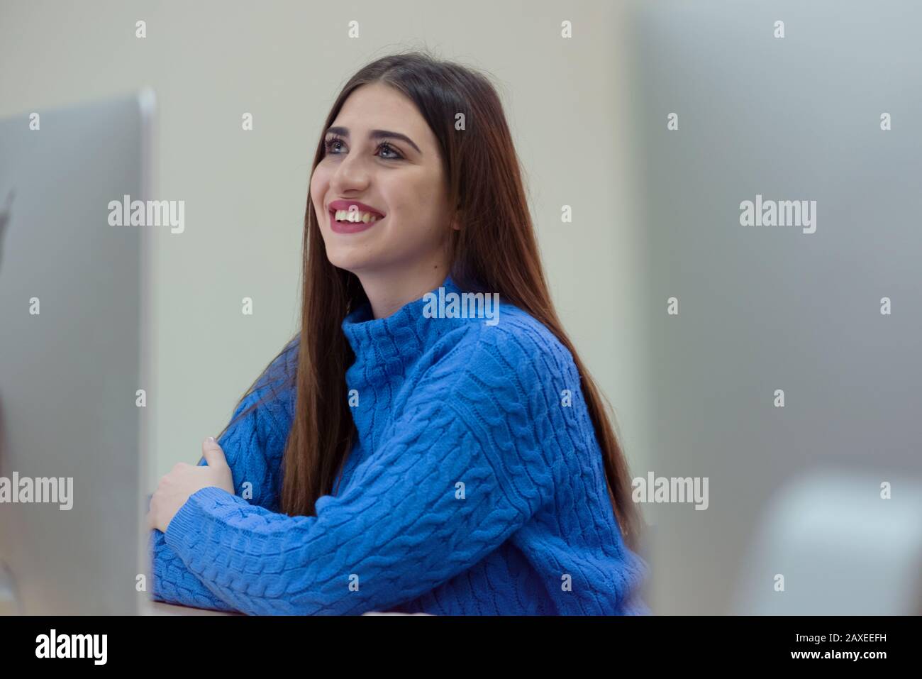 Beautiful female IT student working at her computer lab. Female student ...