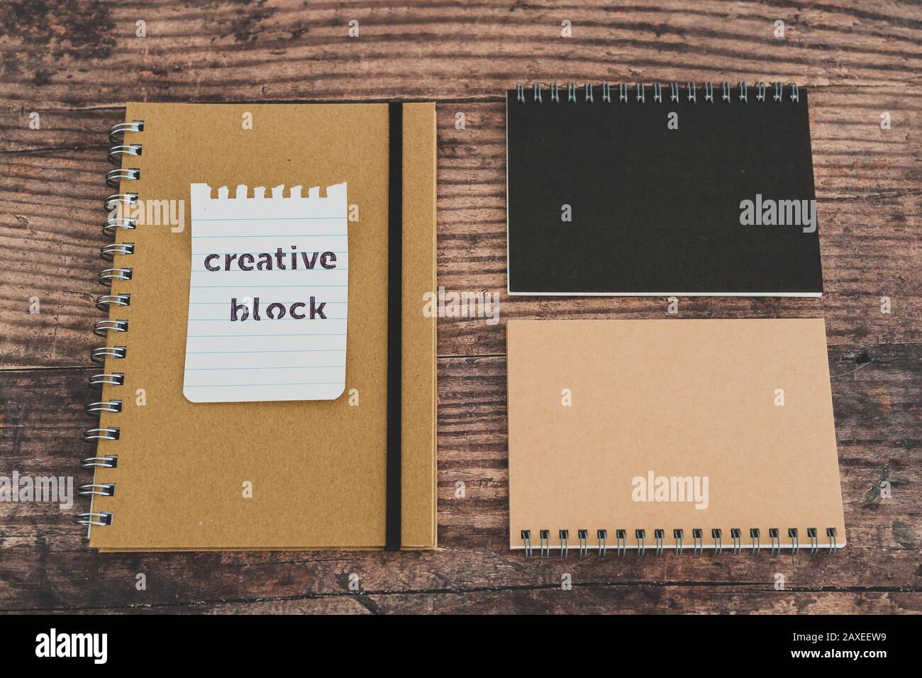 creative block or writer's block conceptual still-life, notepads on ...