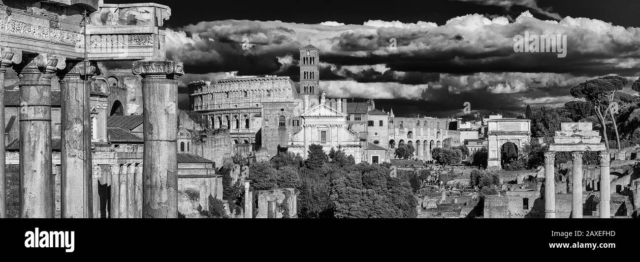 View of Roman Forum ancient ruins with Coliseum and baroque church Stock Photo