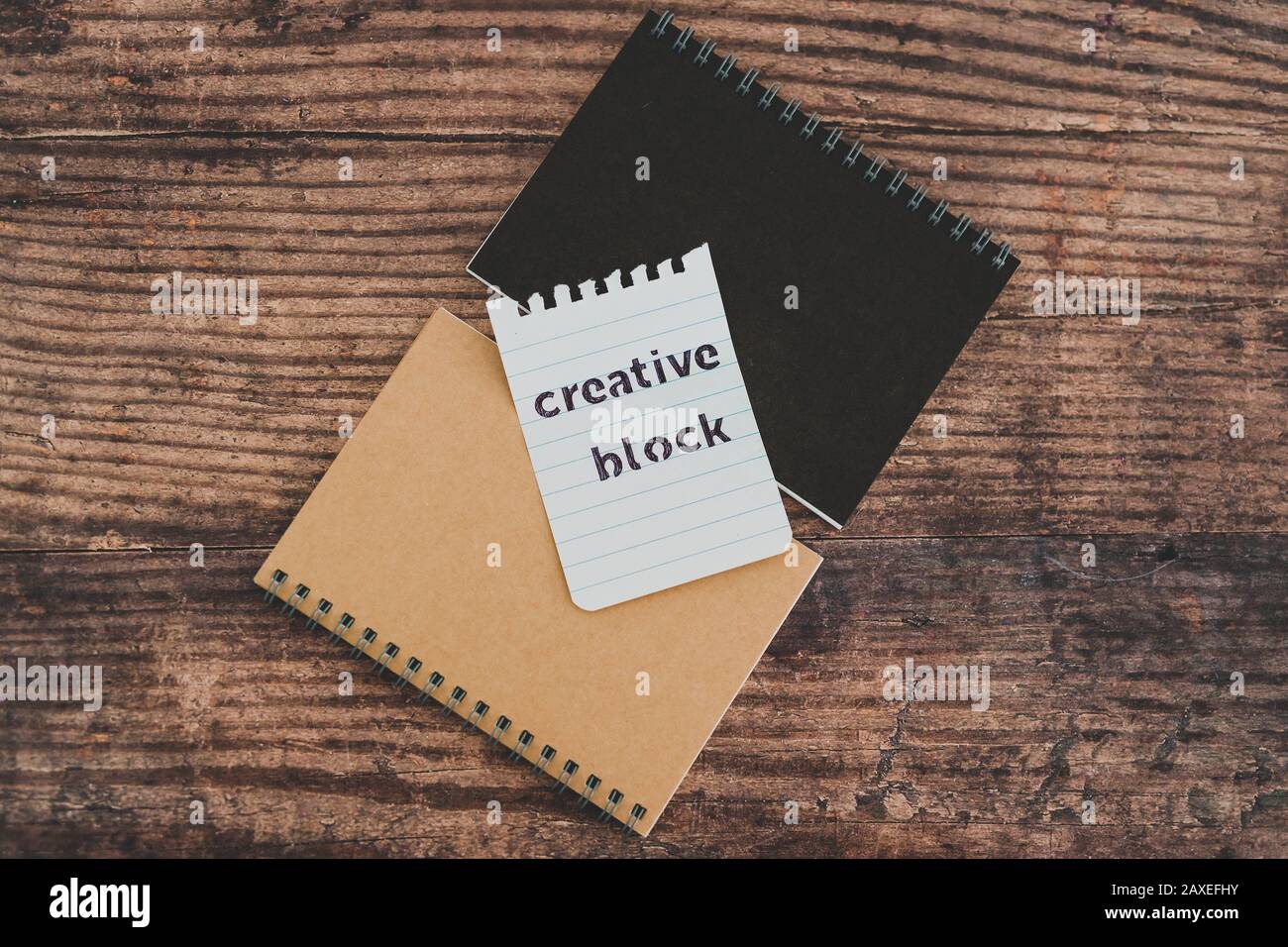 creative block or writer's block conceptual still-life, notepads on ...