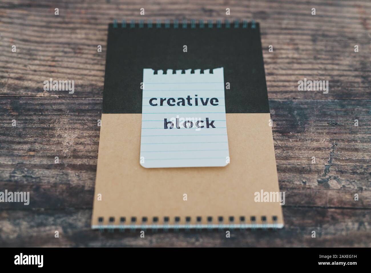 creative block or writer's block conceptual still-life, notepads on ...