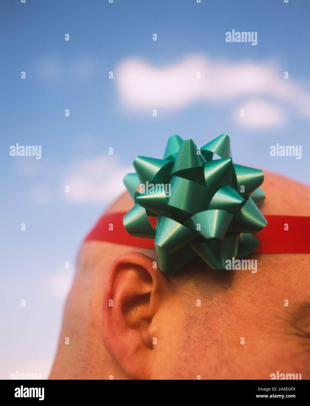 Close-up of a man wearing a ribbon around his head, Germany Stock Photo