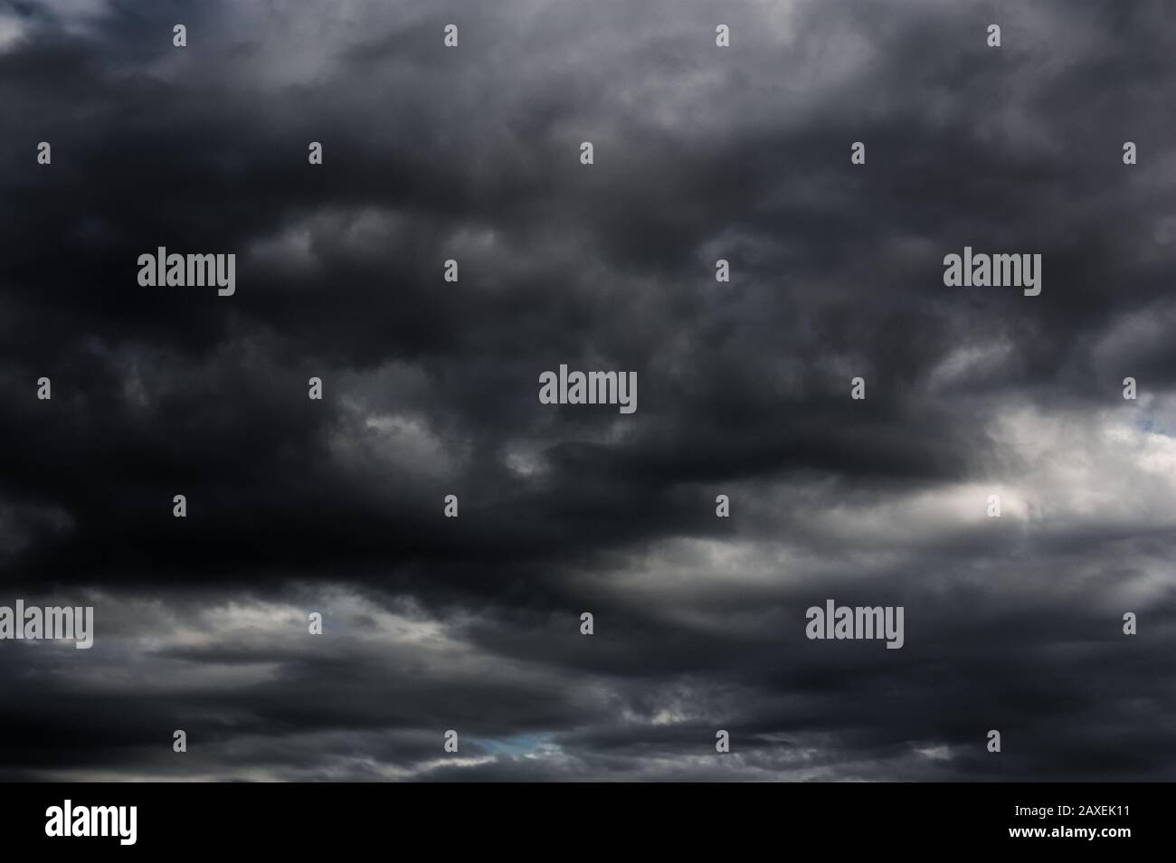 Abundant black clouds cover the sky announcing the storm. Stock Photo
