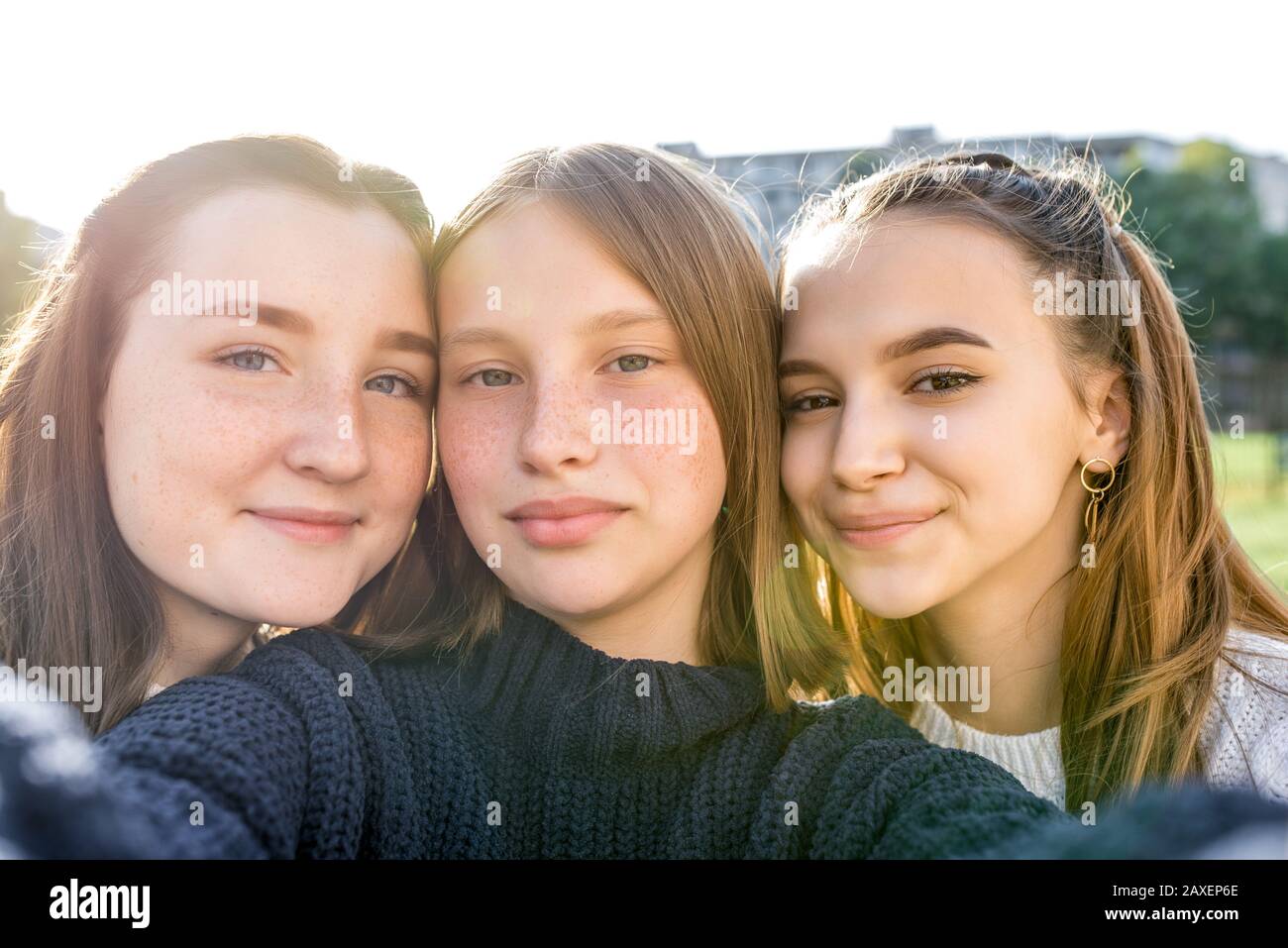 Three Teenage Girls Of 12 14 Years Old Summer City Watching Videos Phone Happy Smiling People 