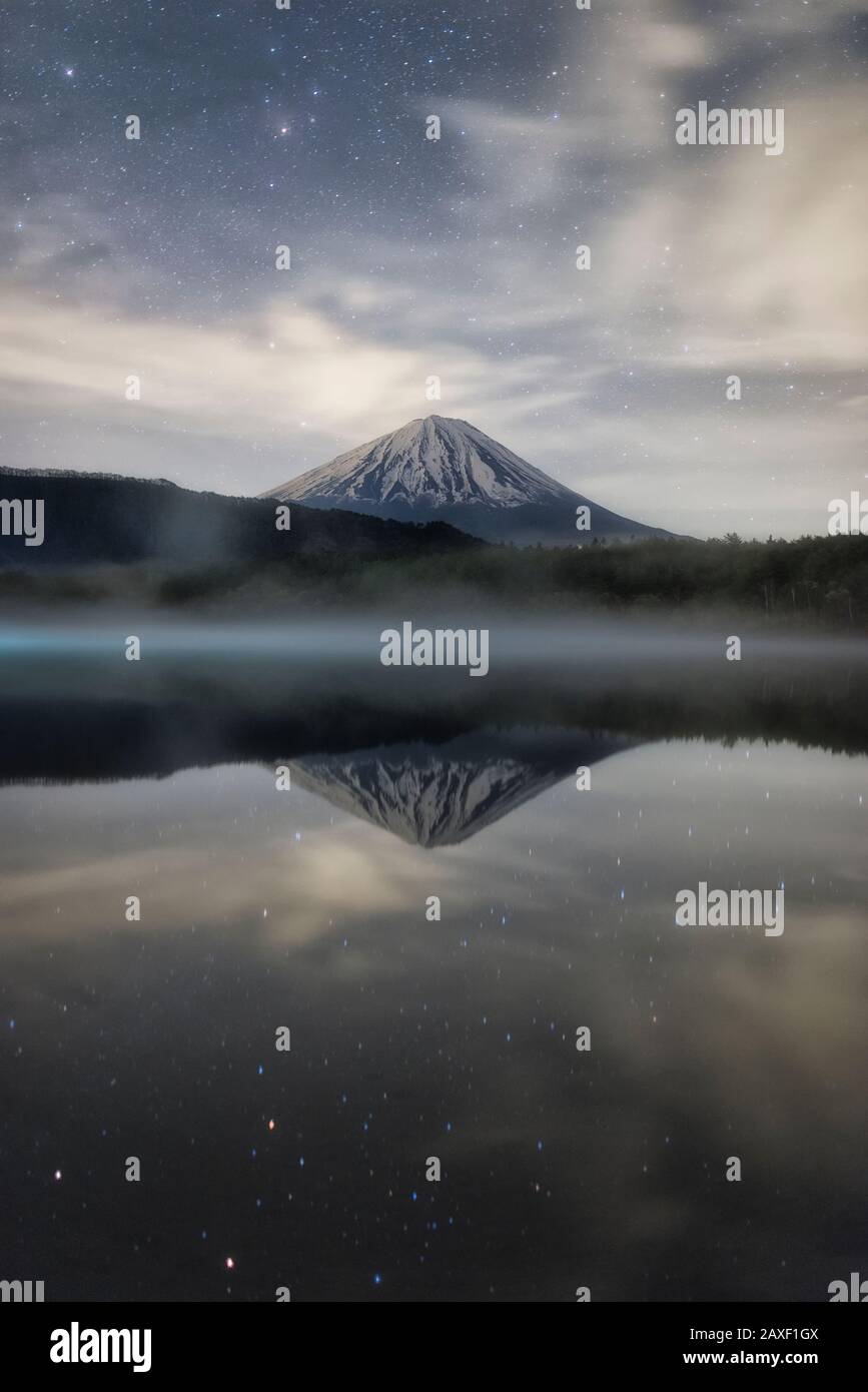 Mt. Fuji Reflected in Lake Sai at Night Stock Photo