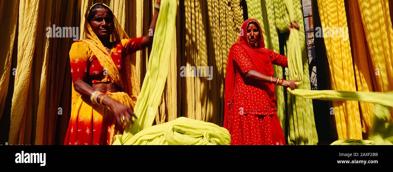 Portrait of two mature women working in a textile industry, Rajasthan, India Stock Photo
