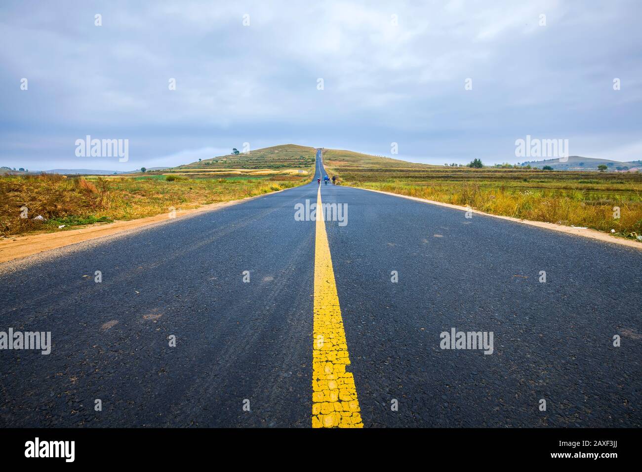 asphalt road on grassland Stock Photo - Alamy