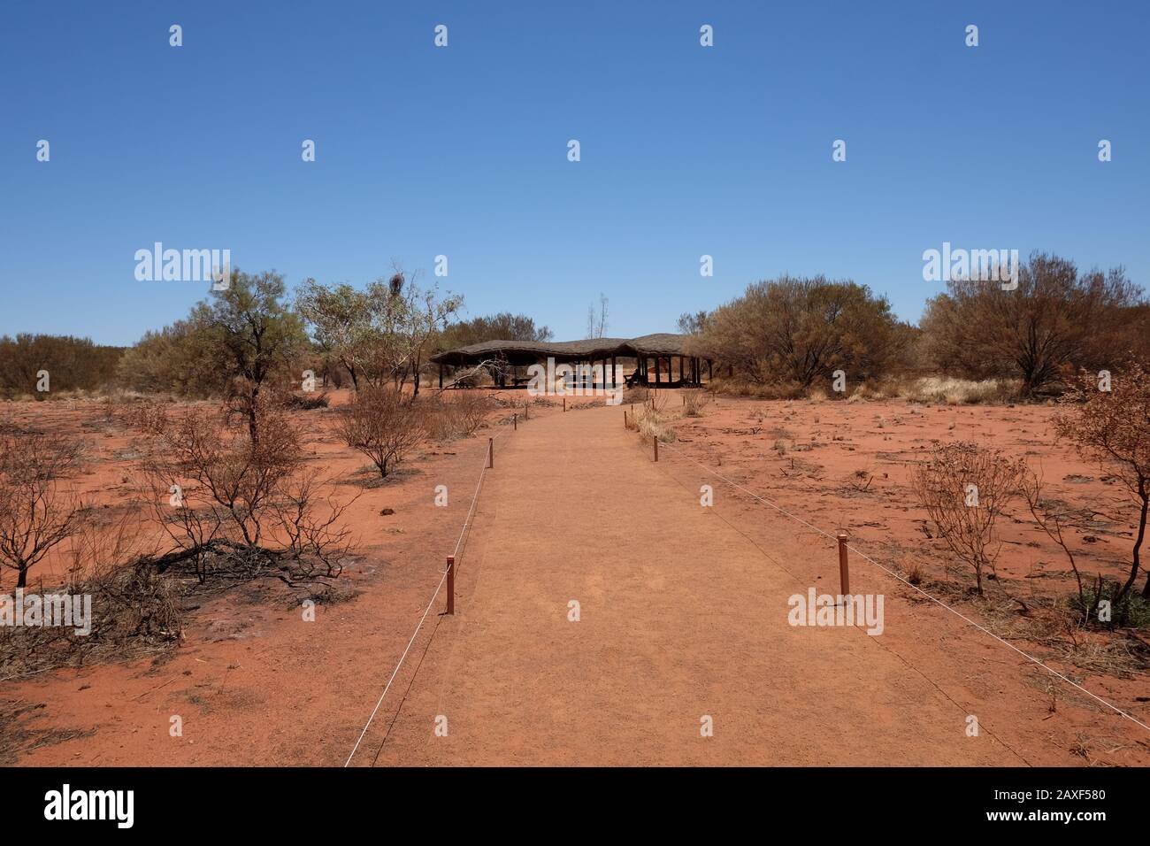Open shade huts at Uluru-Kata Tjuta National Park, massive sandstone monoliths in the Northern Territory’s 'Red Centre' arid desert region Stock Photo