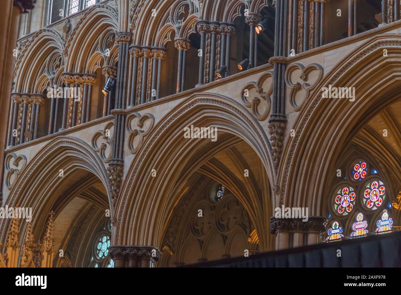 Beautiful view of the arches and colorful windows of Lincoln Cathedral in the UK Stock Photo