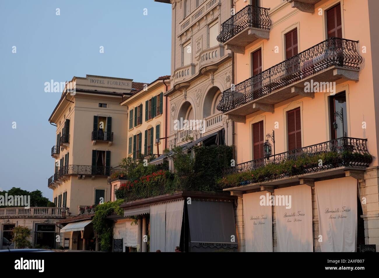 Pastel painted Bellagio hotels with elaborate balustraded balconies of