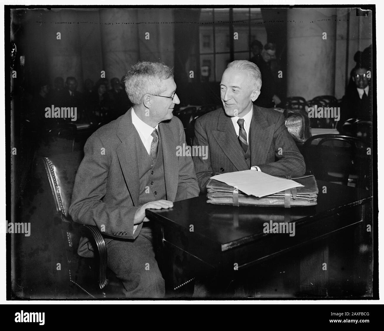 'English: Title: Appear before the Senate Judicary. Washington, D.C., March 18. Appearing before the Senate Judicairy Committee today in defense of the Presidents Supreme Court reorganization plan were Charles Grove Haines of the University of Calif. who is a Professor of Political Science, left: and Dean Leon Green, Dean fo the Law School of Northeaster Univ., right Abstract/medium: 1 negative : glass ; 4 x 5 in. or smaller; 1937; Library of Congress Catalog: https://lccn.loc.gov/2016871382 Image download: https://cdn.loc.gov/master/pnp/hec/22400/22405a.tif Original url: https://www.loc.gov/p Stock Photo