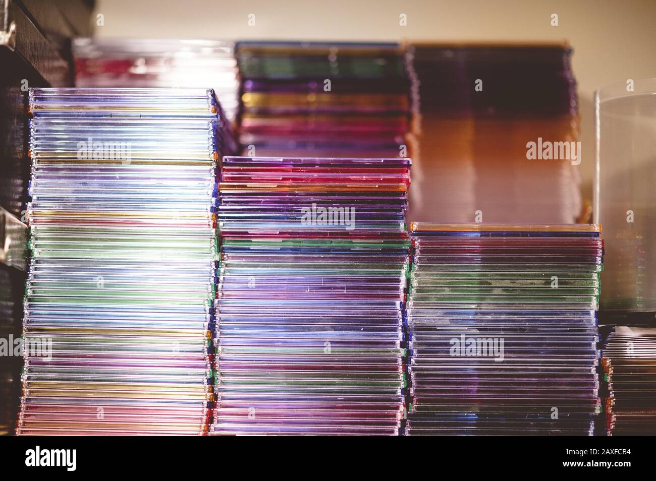 Closeup shot of a stack of CDs on a blurred background Stock Photo
