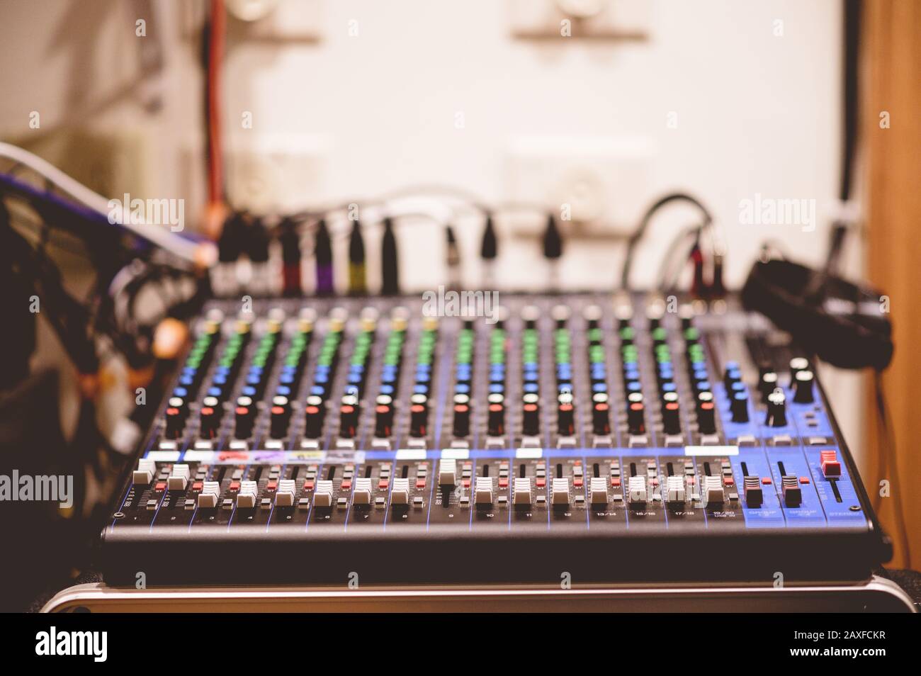 Sound recording control panel in a studio with a blurred background