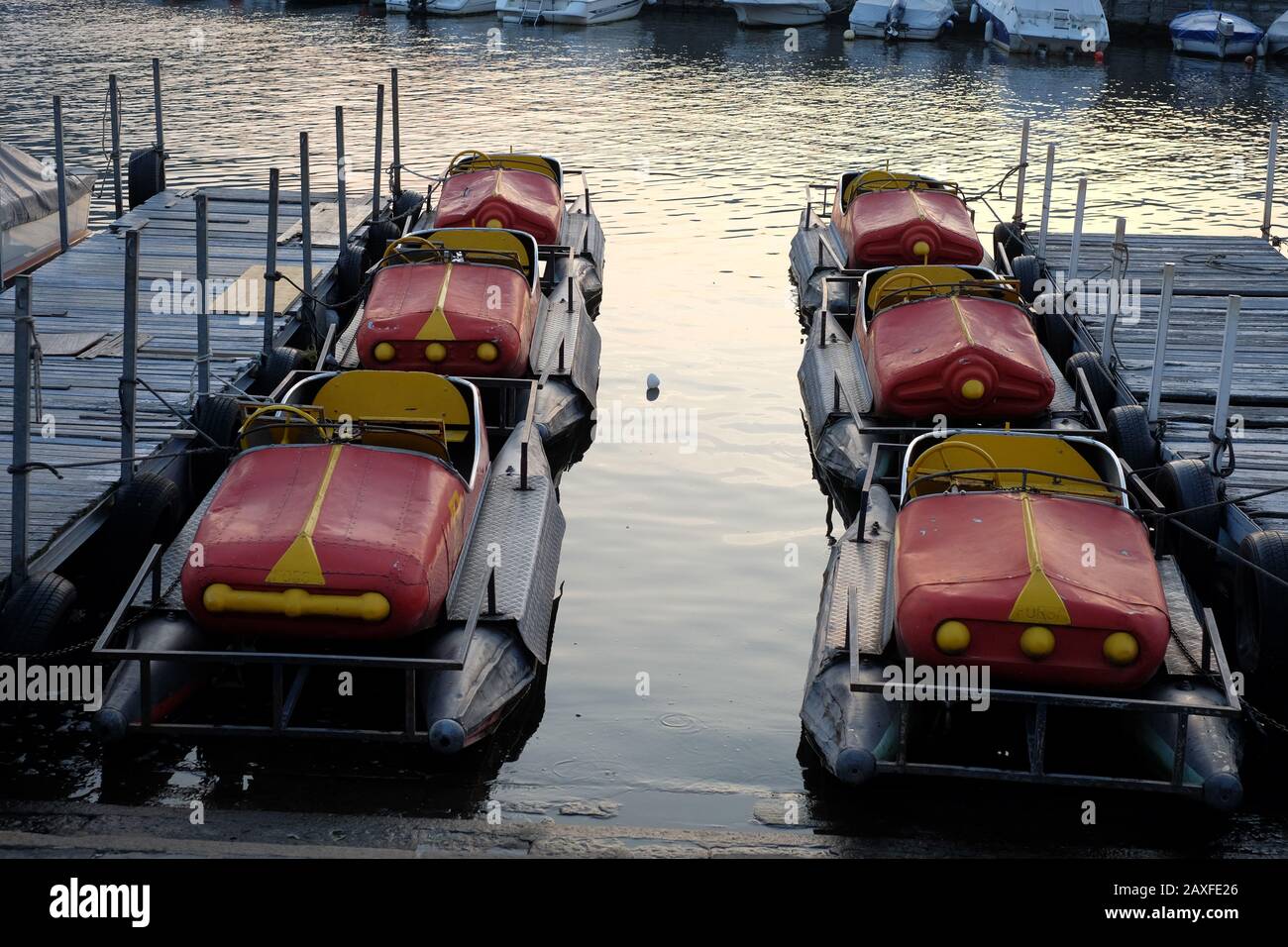 Pedal boats on Lake Como, Lombardy Italy, a beautiful alpine lake of picturesque villages, luxurious villas, palazzo, holiday resorts dramatic scenery Stock Photo