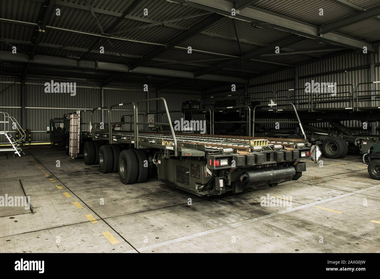 Daily inspections are required on a 60k Tunner loader at Ramstein Air Base, Germany. Feb. 5, 2020. The Tunner has a 60,000 pound carrying capacity which assists in the transport of pallets to and from aircraft. (U.S. Air Force photo by Airman 1st Class Andrew J. Alvarado) Stock Photo