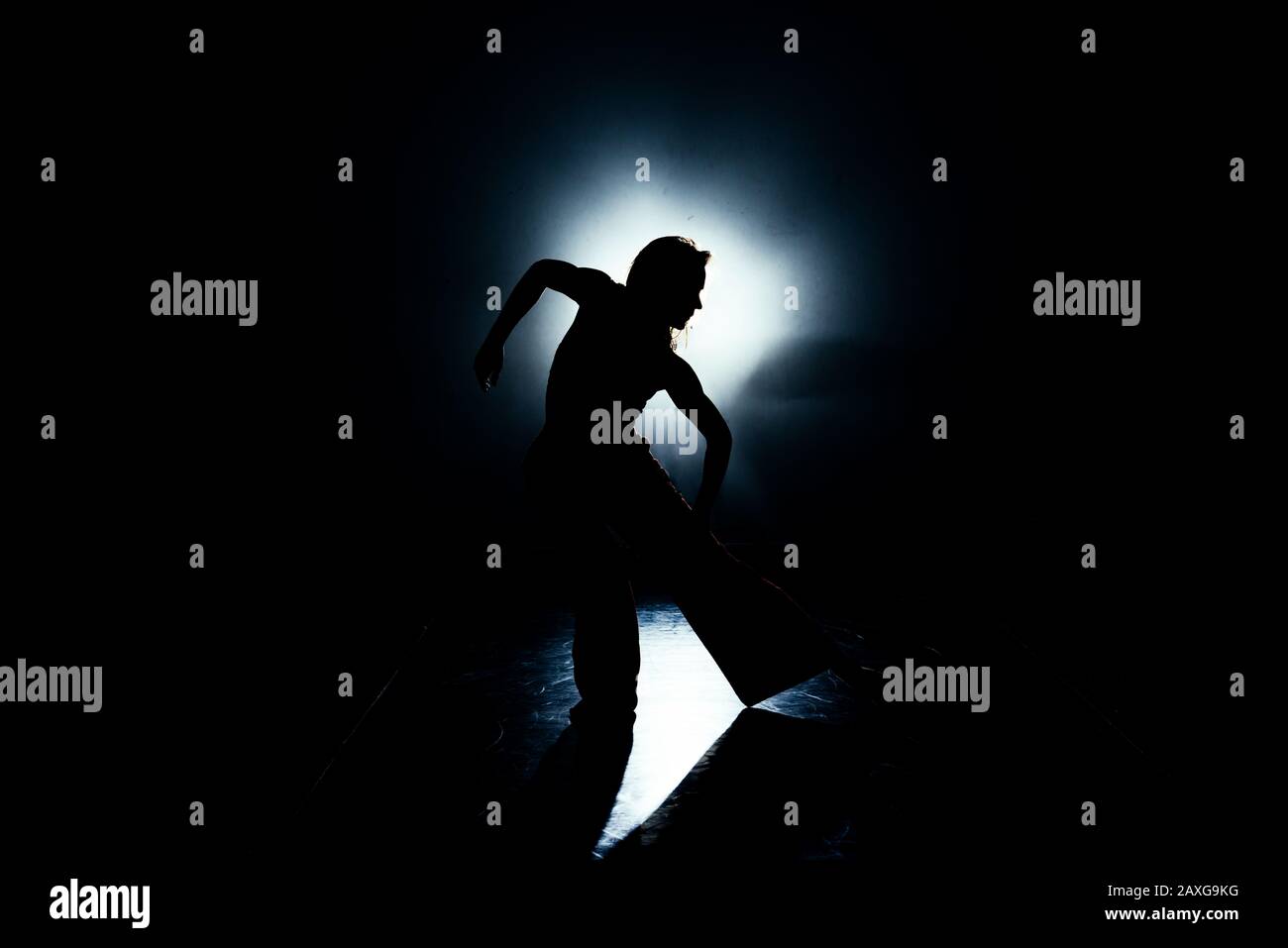 Artistic modern dancer practicing dancing moves in the studio Stock Photo