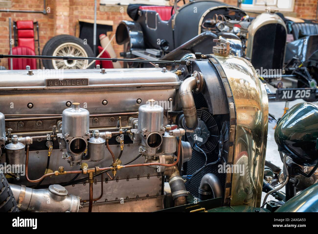 Vintage bentley engine in a restoration workshop at Bicester Heritage Centre sunday scramble event. Bicester, Oxfordshire, England Stock Photo