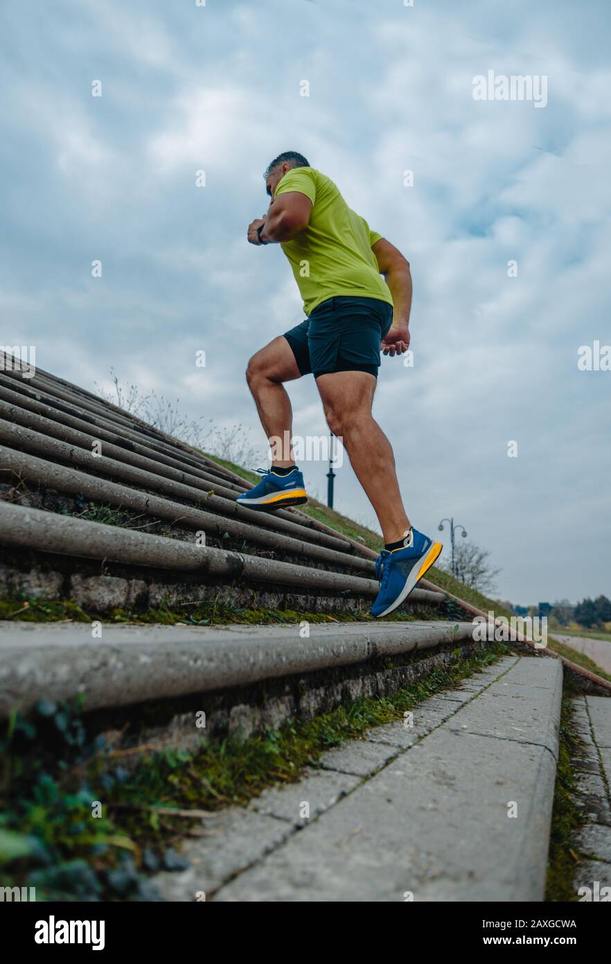 Mature man running up stairs hi-res stock photography and images - Alamy