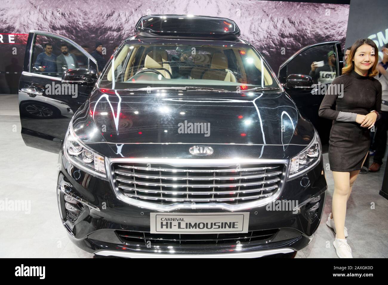 GREATER NOIDA, INDIA – FEBRUARY 7, 2020: Visitors check out the Kia Carnival Hi-Limousine on display at Auto Expo 2020 at Greater Noida in India. Stock Photo