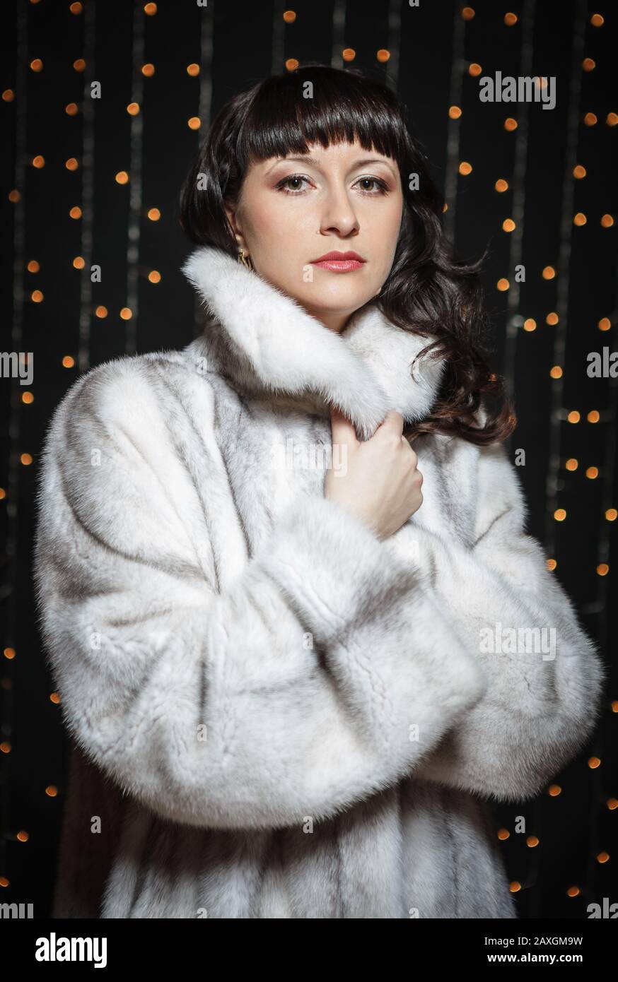 Portrait of beautiful young women in white fur coat Stock Photo - Alamy