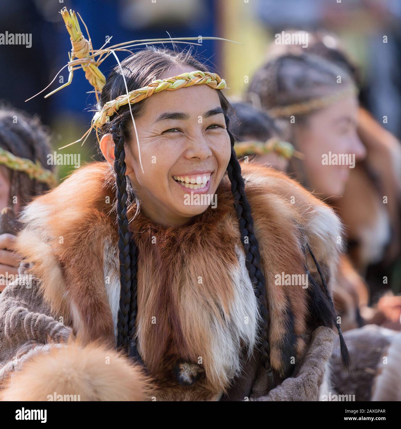 Portrait of expression young woman in clothing aborigine of Kamchatka Peninsula. Itelmens national ritual festival of thanksgiving nature Alhalalalay Stock Photo