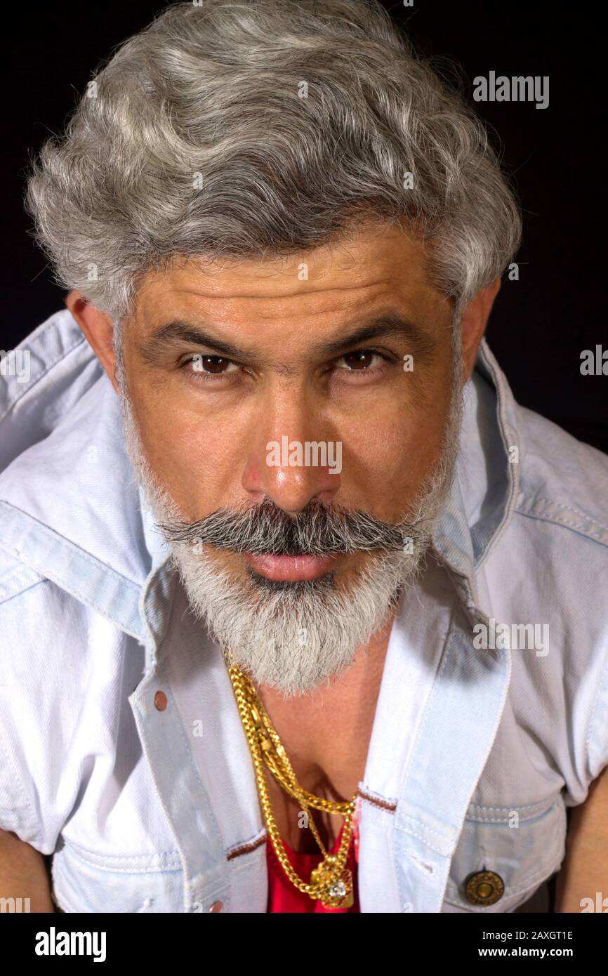 Portrait of stylish old man with gray beard. Face closeup. Looking at camera Stock Photo