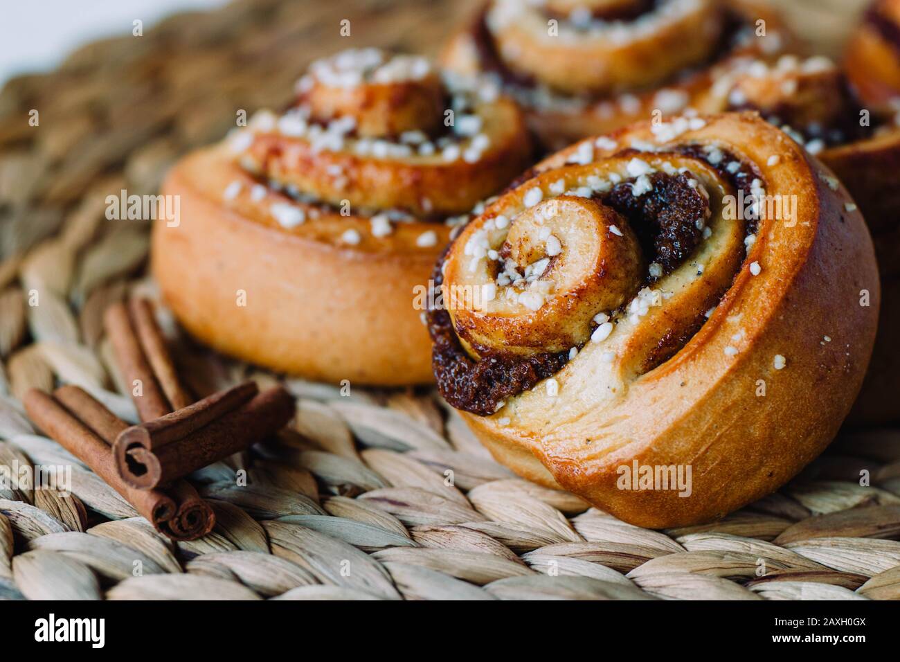 Cinnamon roll close-up on a rustic background Stock Photo
