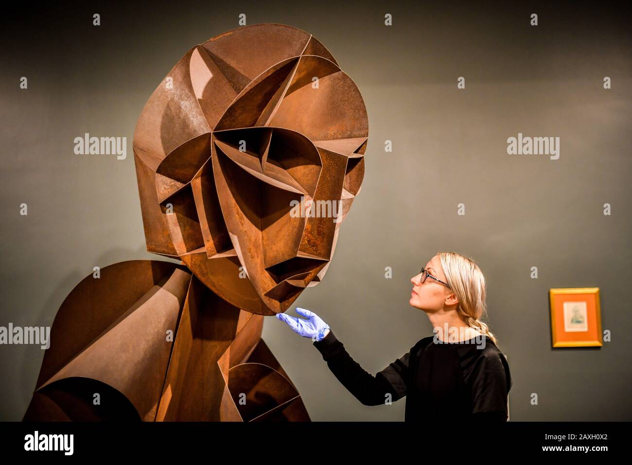 Registrar Helen Bent checks 'Constructed Head No.2' at the Tate St Ives where the Naum Gabo exhibition coincides with the 100th anniversary of the influential sculptor's publication The Realistic Manifesto. Stock Photo