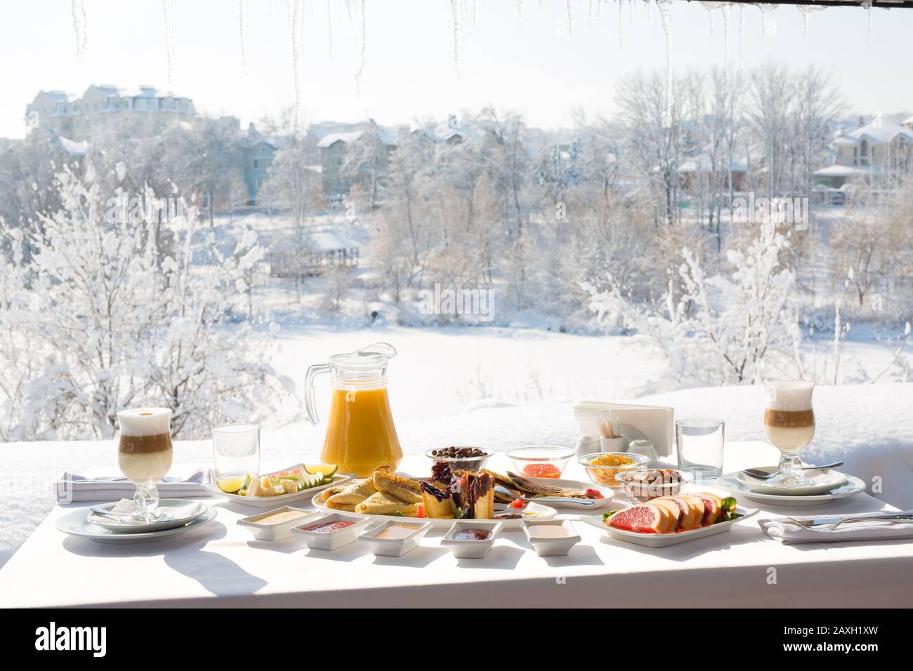 Breakfast at the restaurant in the snowy winter outdoors Stock