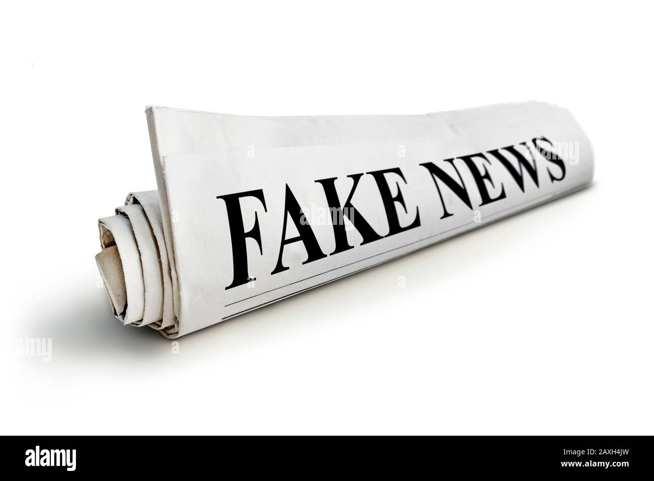 Rolled Up Newspaper with Headline of Fake News Isolated on White Background. concept of false news Stock Photo