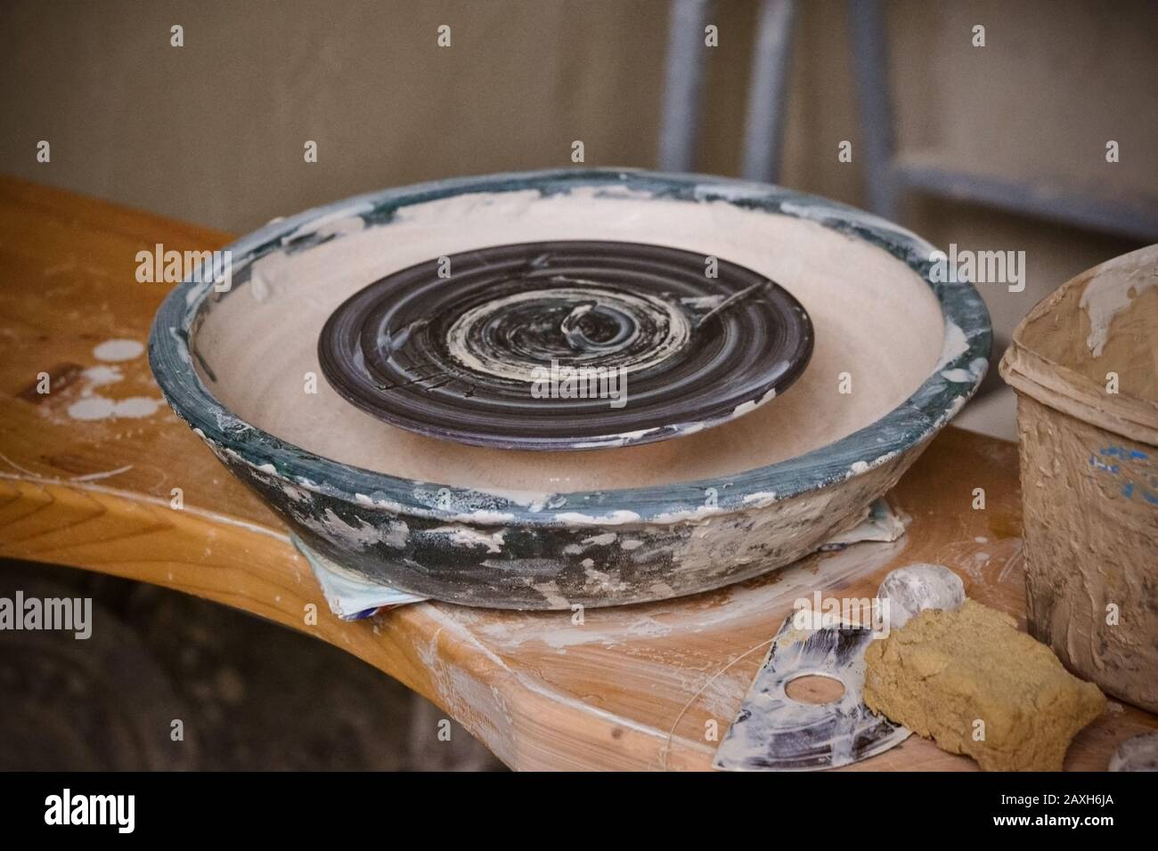 An empty circle, where the potter molds product. Creative studio potter. Workplace wizard Crock pottery Stock Photo