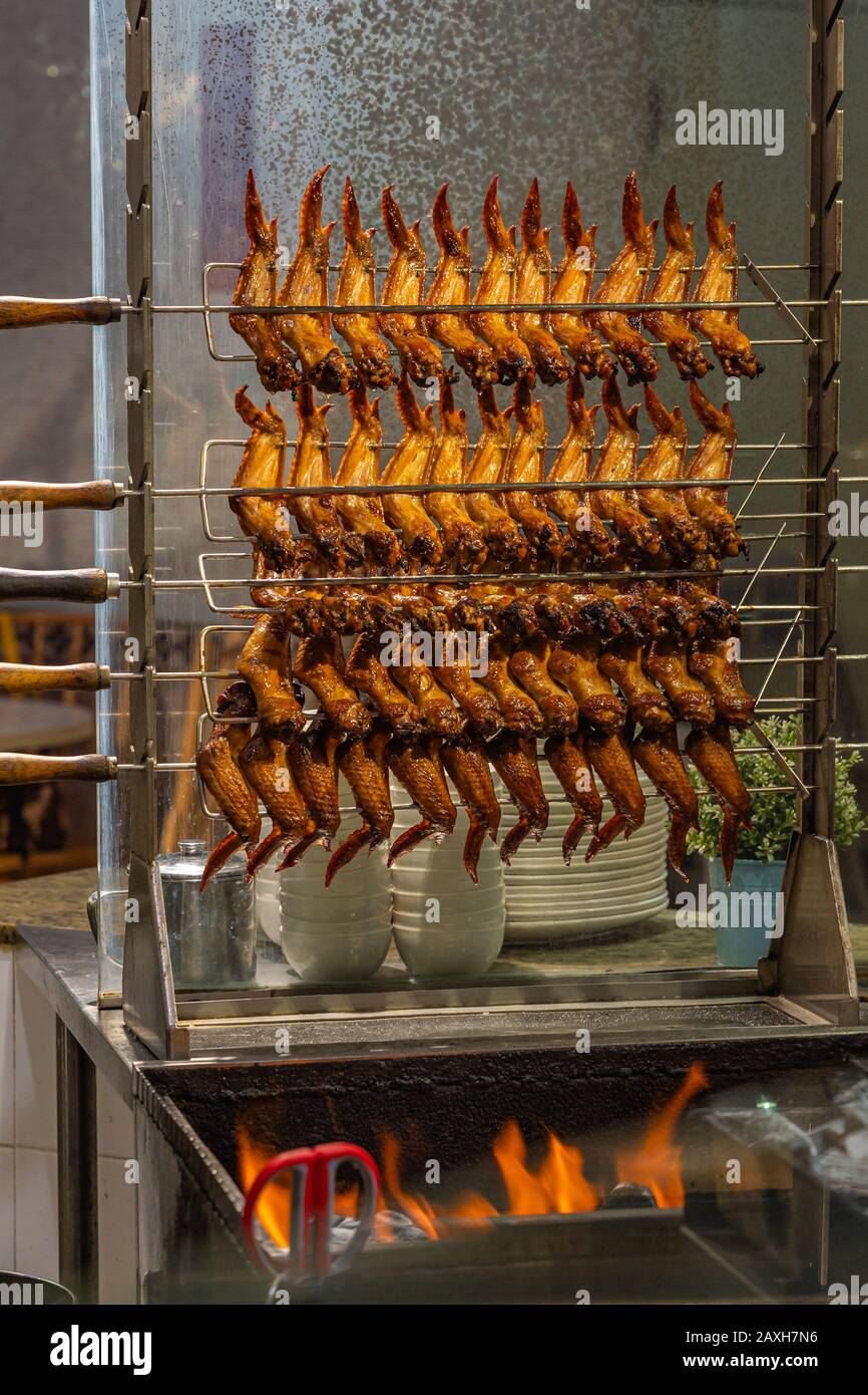 Roasted chicken wings on the flaming charcoal in Chinese restaurant
