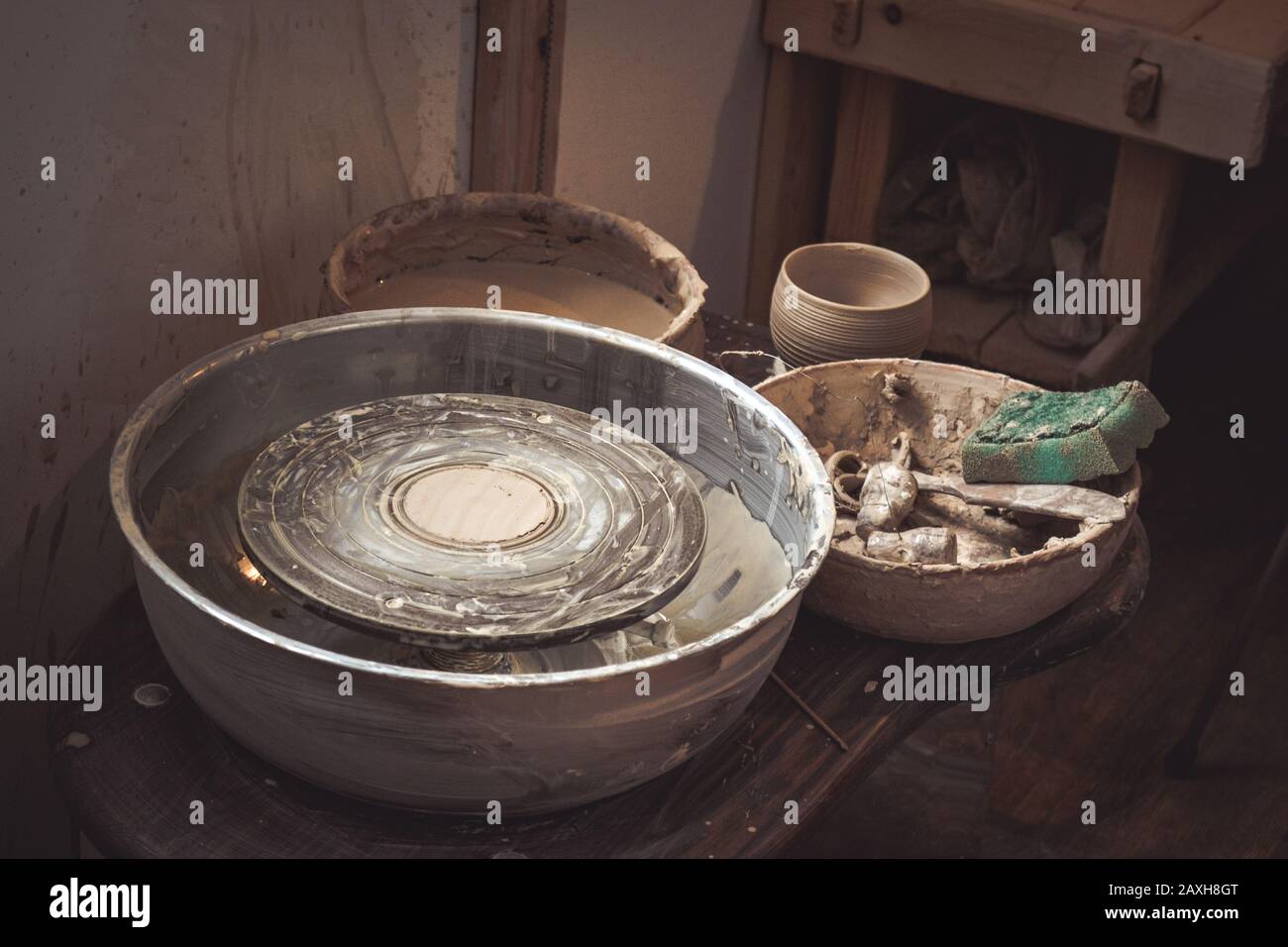 An empty circle, where the potter molds product. Creative studio potter. Workplace wizard Crock pottery Stock Photo