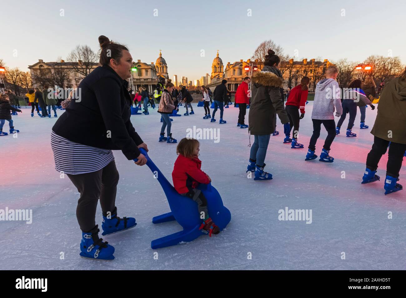 England, London, Greenwich, Adults and Children Ice Skating at The