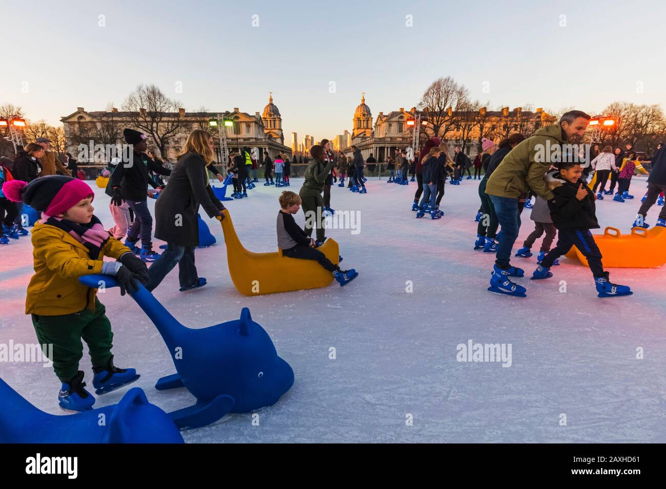 England, London, Greenwich, Adults and Children Ice Skating at The