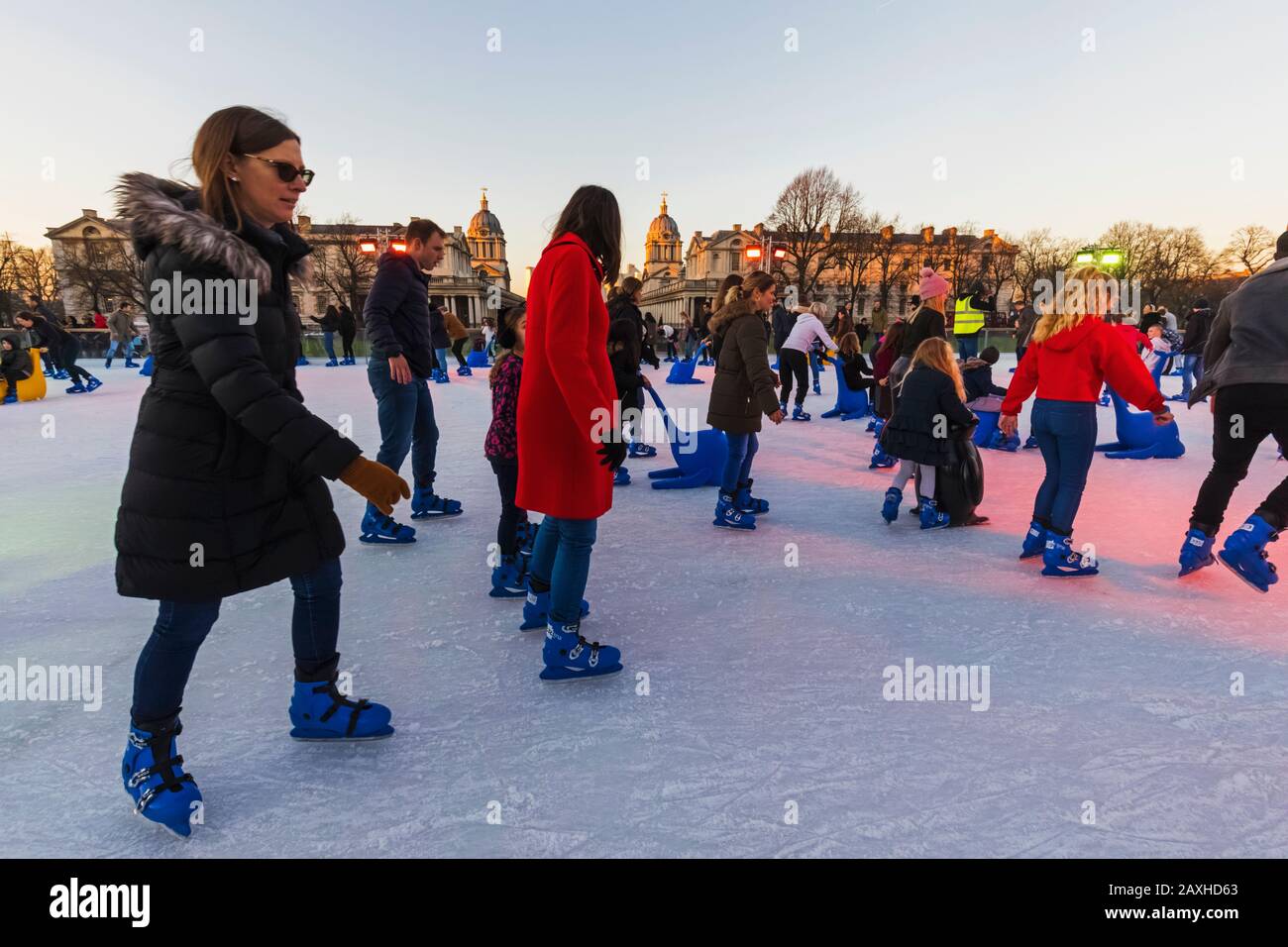 England, London, Greenwich, Adults and Children Ice Skating at The