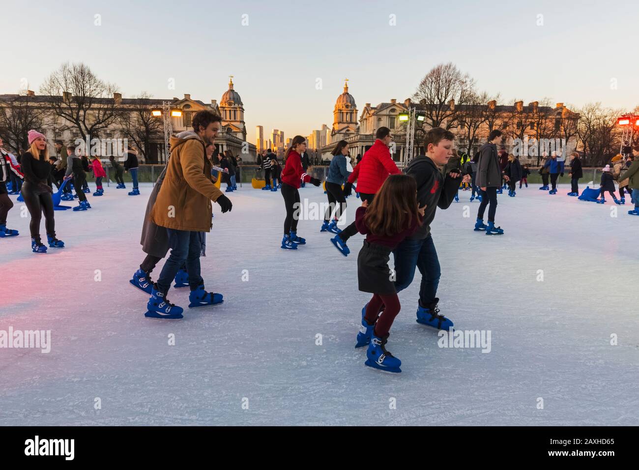 Adults children ice skating at the queens house ice rink hires stock