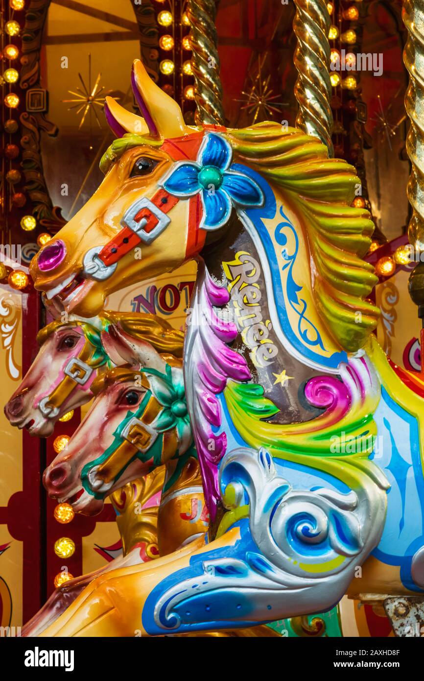 England, London, Greenwich, Fairground Carousel in front of the Cutty Sark, Detail of Merry-go-round Galloping Horses Stock Photo
