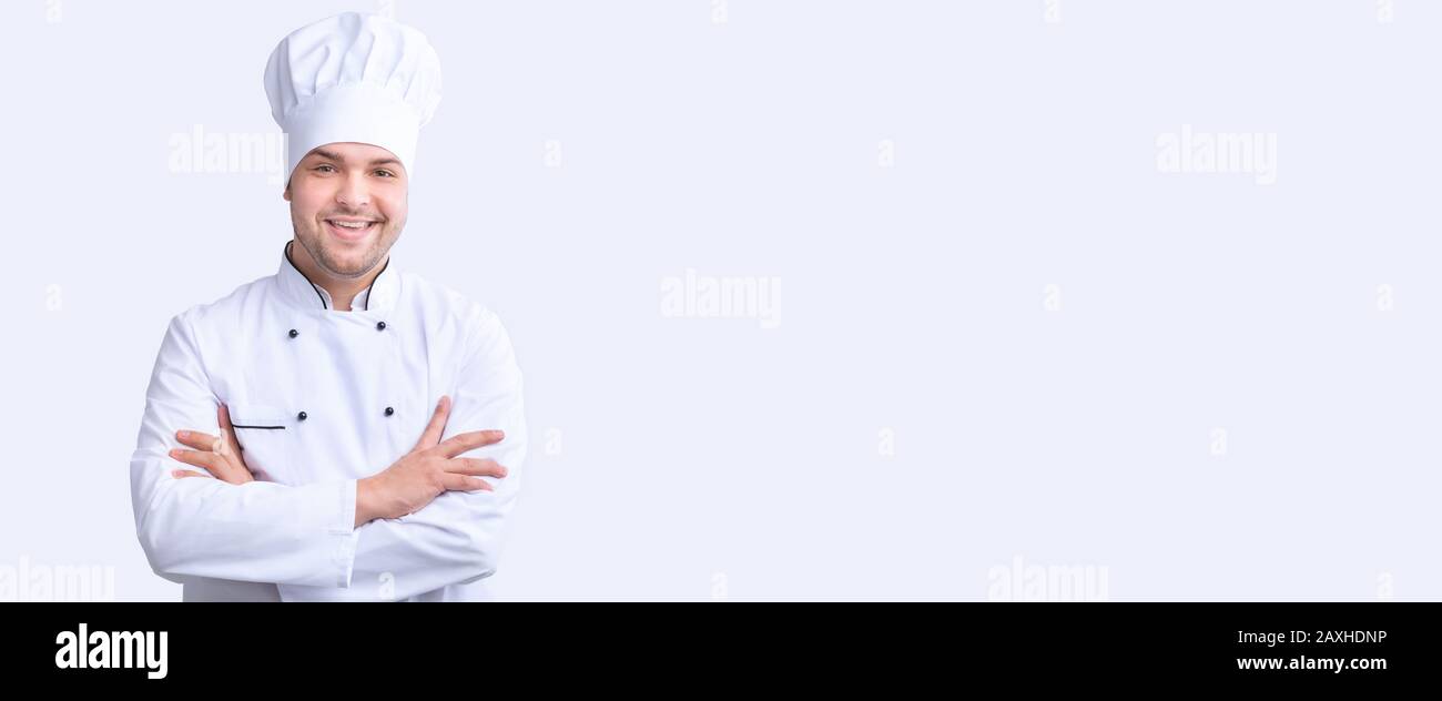 Happy Cook Man Posing Crossing Hands Over White Background, Panorama Stock Photo