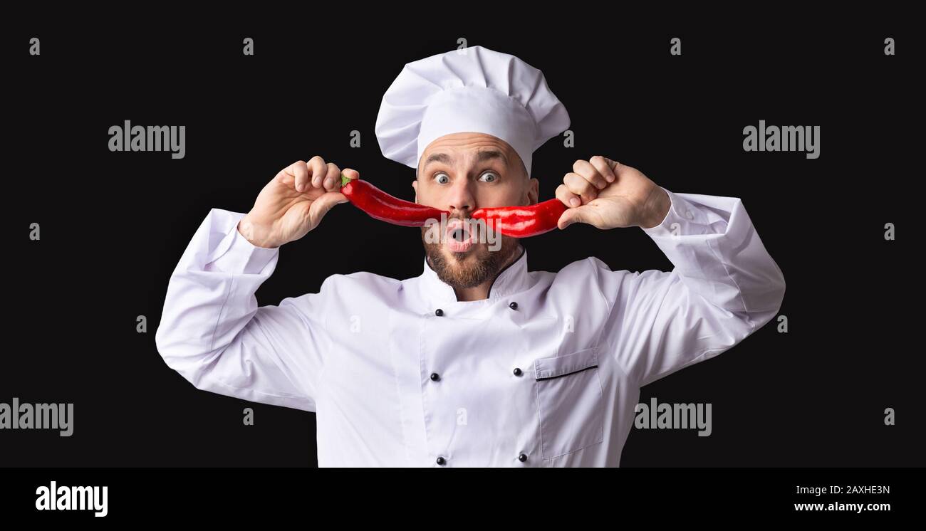 Funny Chef Posing With Food Having Fun Over Black Background Stock Photo