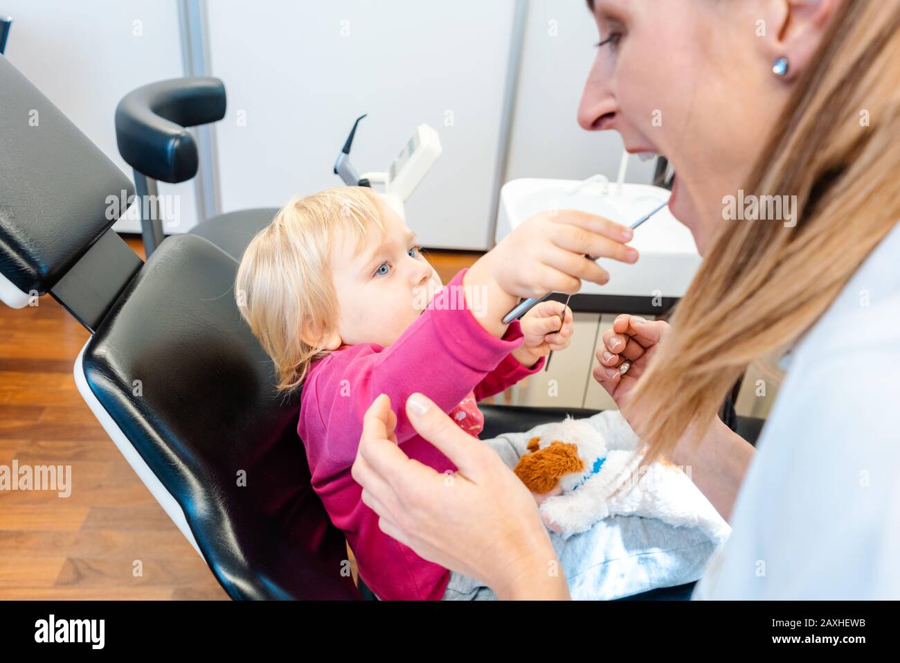 Child in the dentists office comfortable Stock Photo Alamy