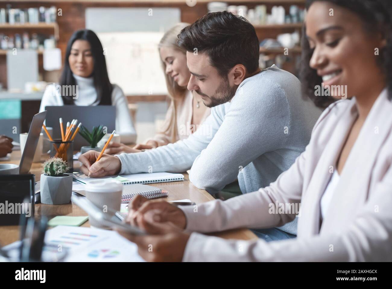 Working process of young multiracial business team Stock Photo