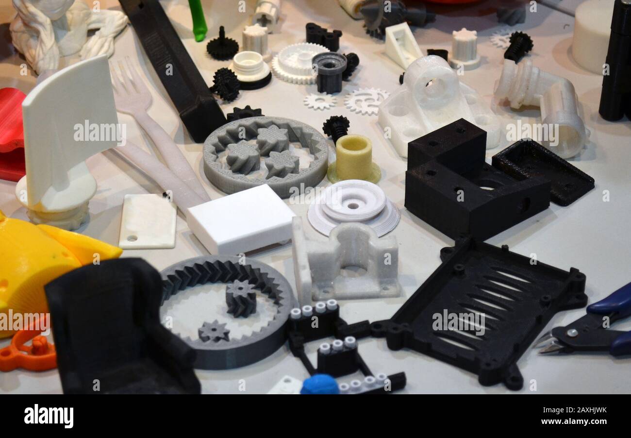 Objects printed by 3d printer. Bright colorful objects printed on a 3d printer on a table Stock Photo