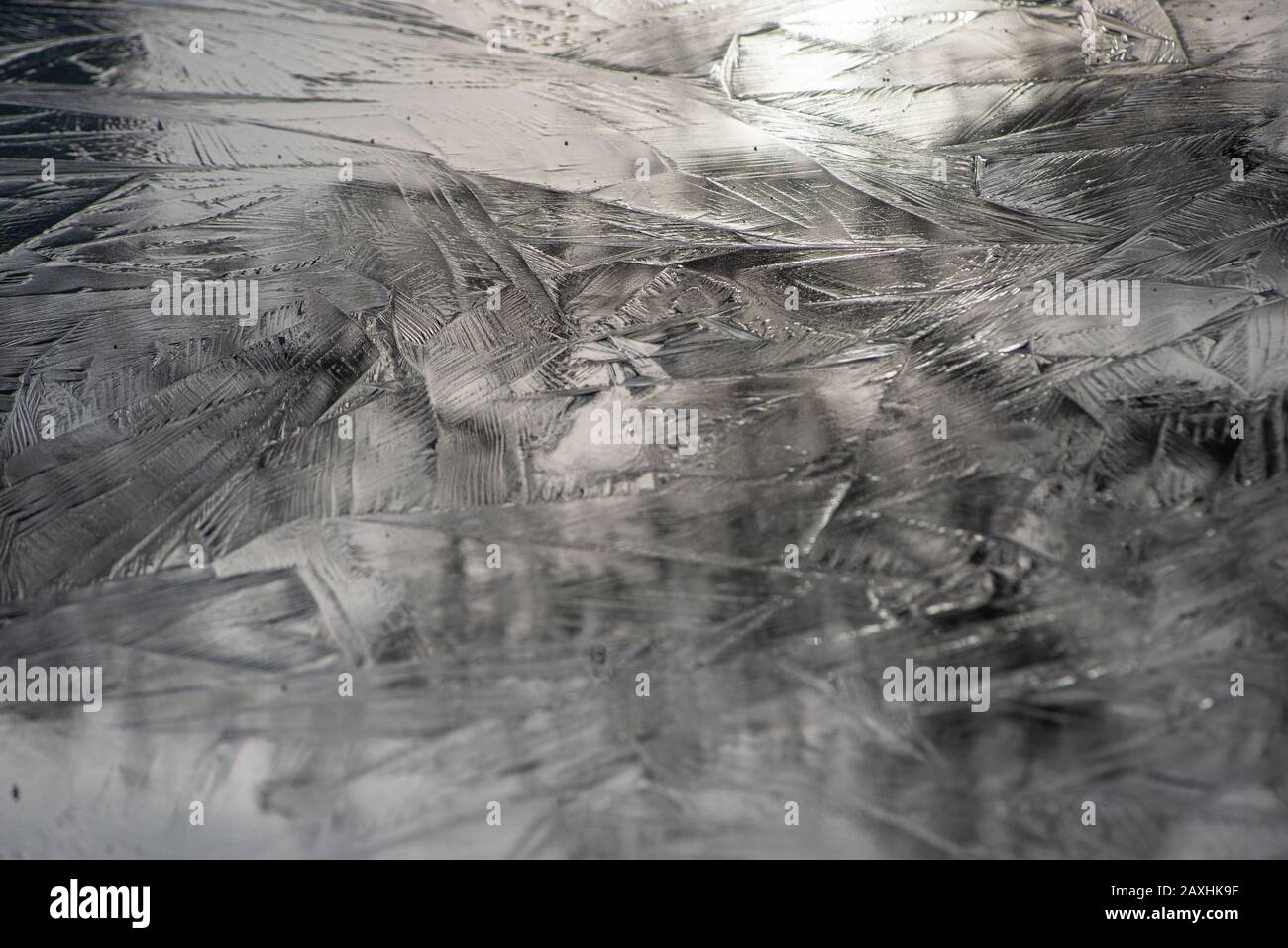 Background of a frosted surface with beautiful crystal patterns Stock